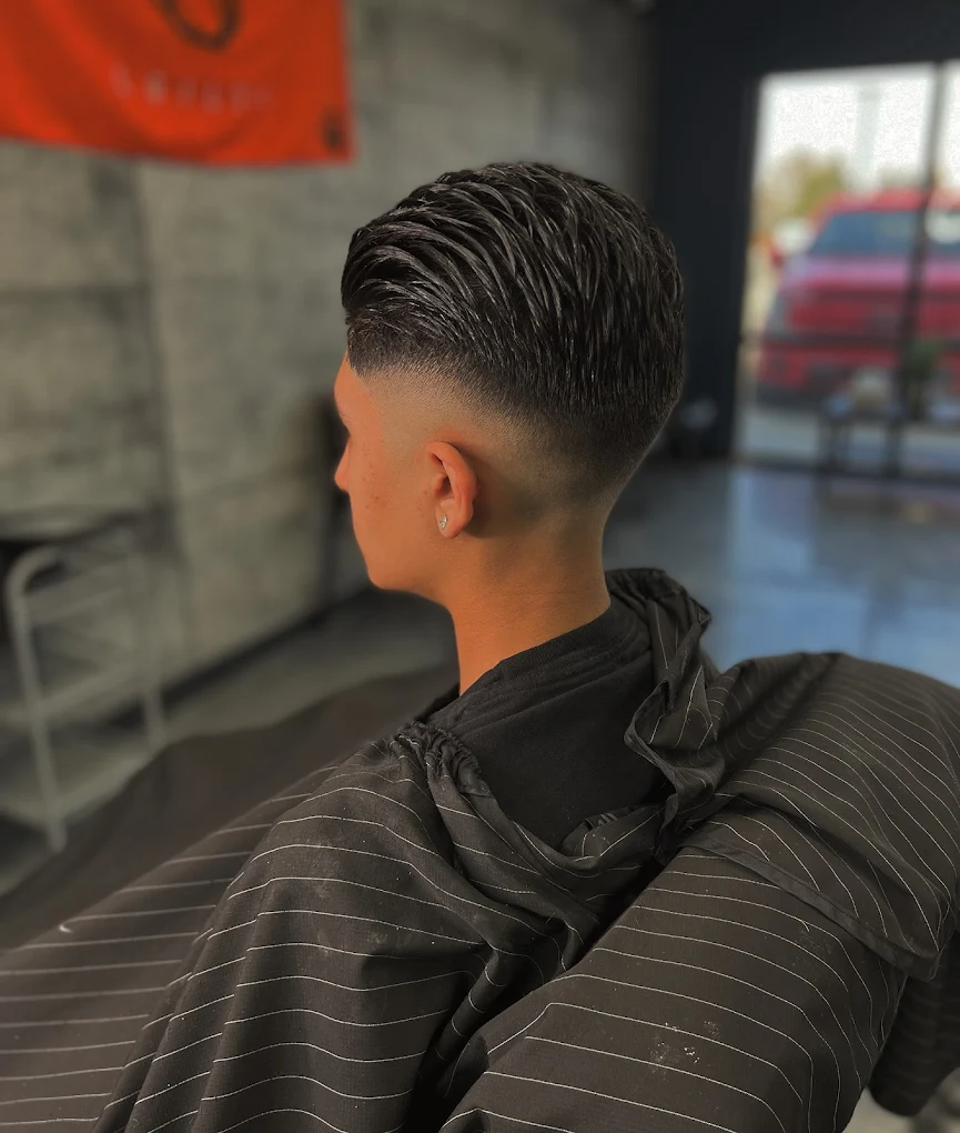 Slicked-back fade haircut